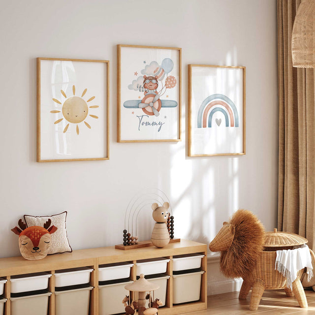 personalised airplane nursery wall art set with sun name and rainbow prints