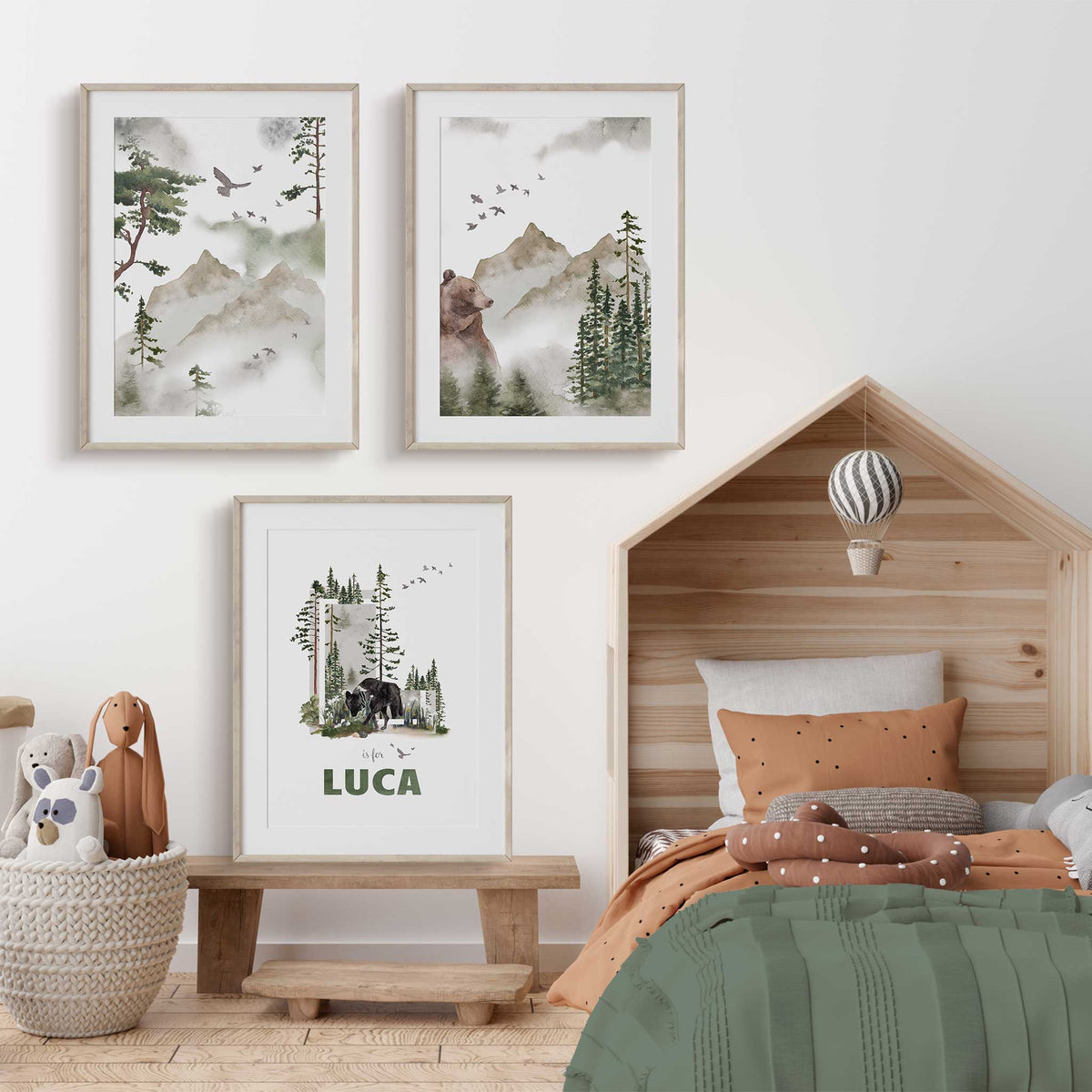 Three personalised woodland prints featuring bears, pine forests, mountains, birds and a child’s name