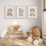 Set of three personalised boys monster truck prints showing colourful vehicles and a custom initial and name design.