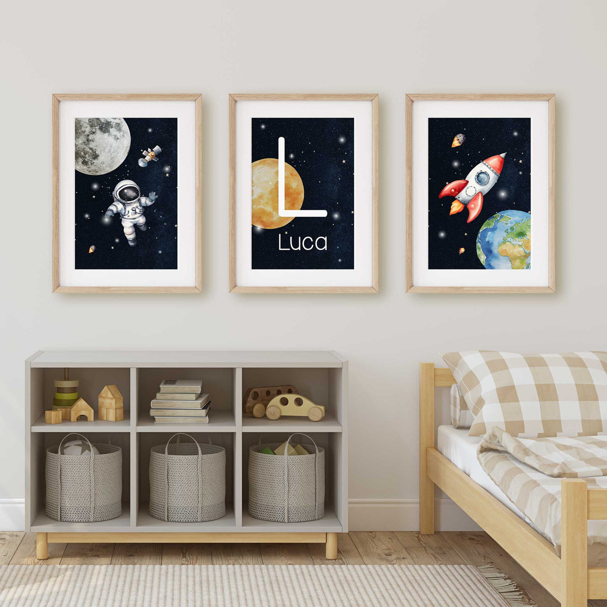 Set of three space-themed nursery prints: astronaut, personalized moon, and rocket.