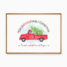Personalised Christmas print with a family name above a red vintage truck carrying a decorated tree and a festive quote