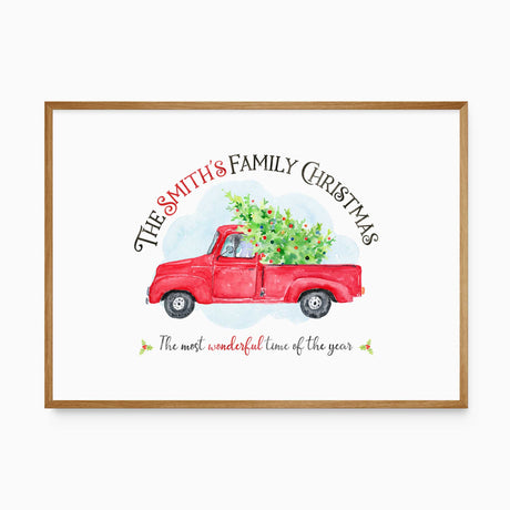 Personalised Christmas print with a family name above a red vintage truck carrying a decorated tree and a festive quote