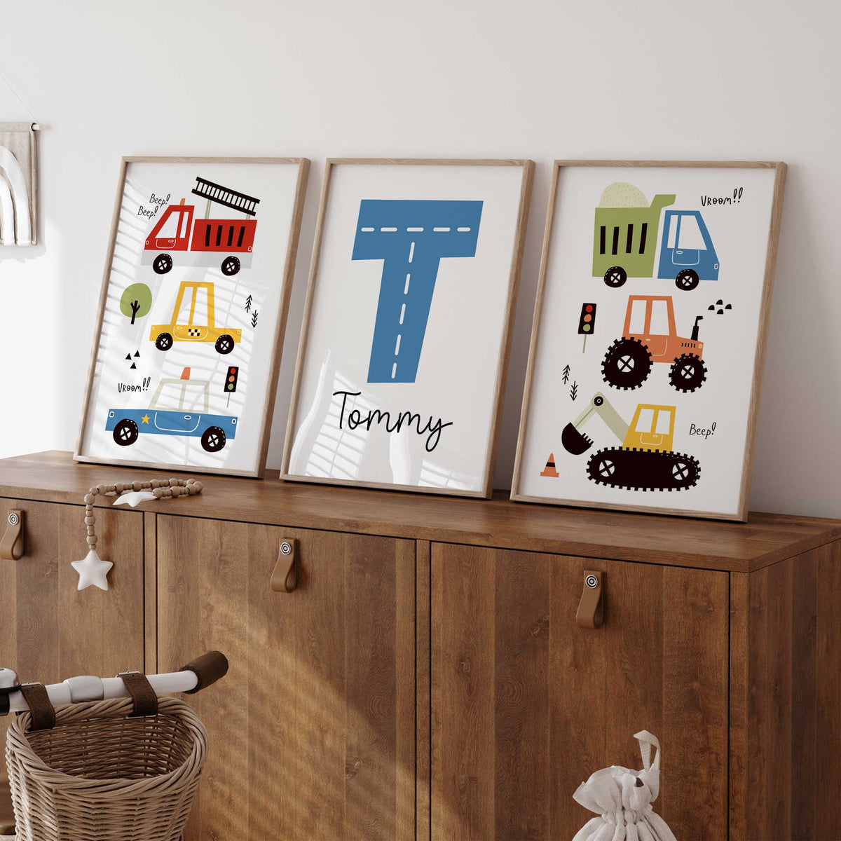 Three colourful personalised construction and emergency vehicle prints with a road-style initial and custom name