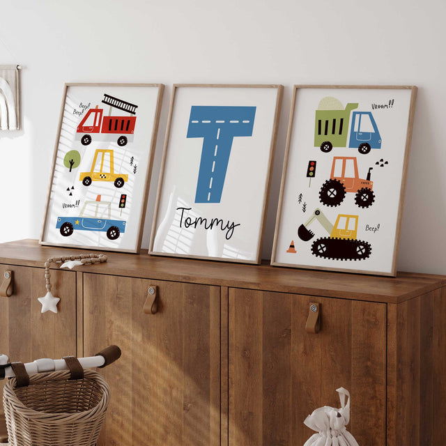Three colourful personalised construction and emergency vehicle prints with a road-style initial and custom name