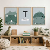 Set of three soft green dinosaur prints with two illustrated dinosaurs and a centre print personalised with an initial and name