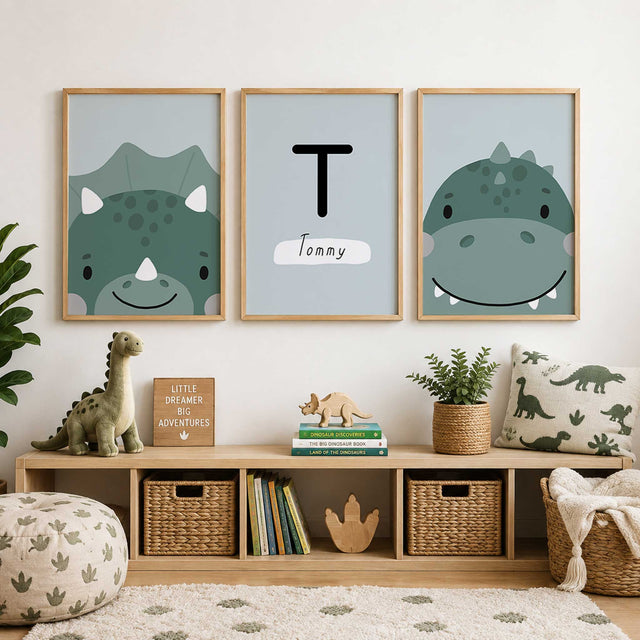 Set of three soft green dinosaur prints with two illustrated dinosaurs and a centre print personalised with an initial and name