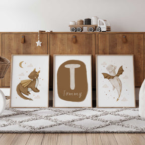 Personalised dragon prints set of three with brown and cream baby dragons, stars, clouds and a custom name and initial design.