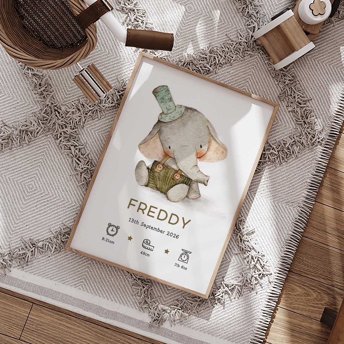 Personalised elephant birth print with baby elephant wearing a green hat and overalls, child's name and birth details