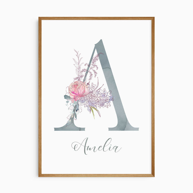 Personalised floral initial wall art print with pastel watercolour letter and botanical illustration for nursery décor.