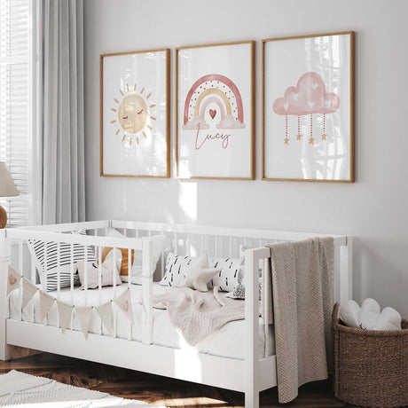 Matching nursery wall art set for girls with sun, rainbow, and cloud designs