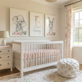 Personalised girls nursery wall art set with elephant and bunny prints, pink florals and a custom initial name print.