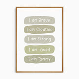 Green affirmation print with white lettering reading I am Brave, Creative, Strong and Loved, ending with I am and name