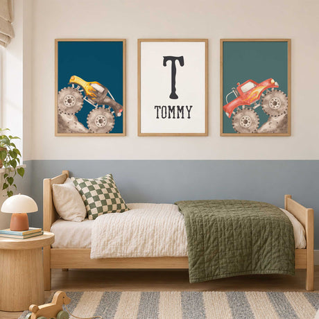 Personalised monster truck print set with yellow and red trucks on blue and teal, plus a black initial and name.
