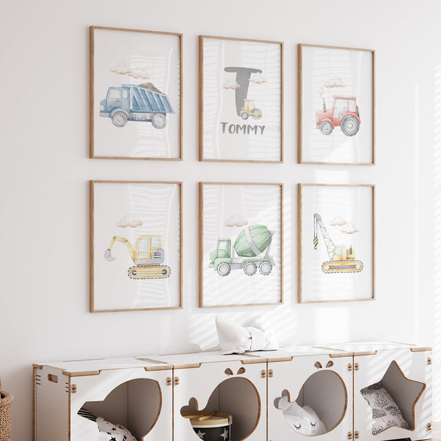 Set of six watercolour construction prints with multicolour vehicles, clouds and a grey initial above the name.