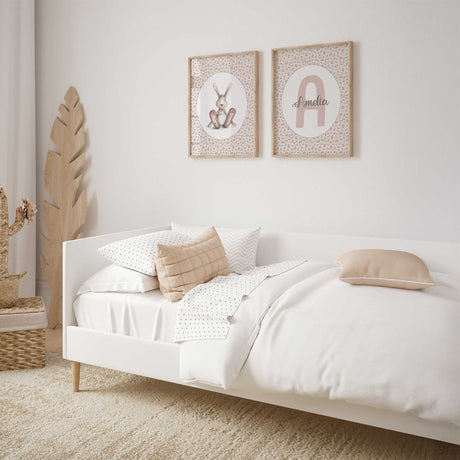 Custom name wall art with floral background and large initial for girls.