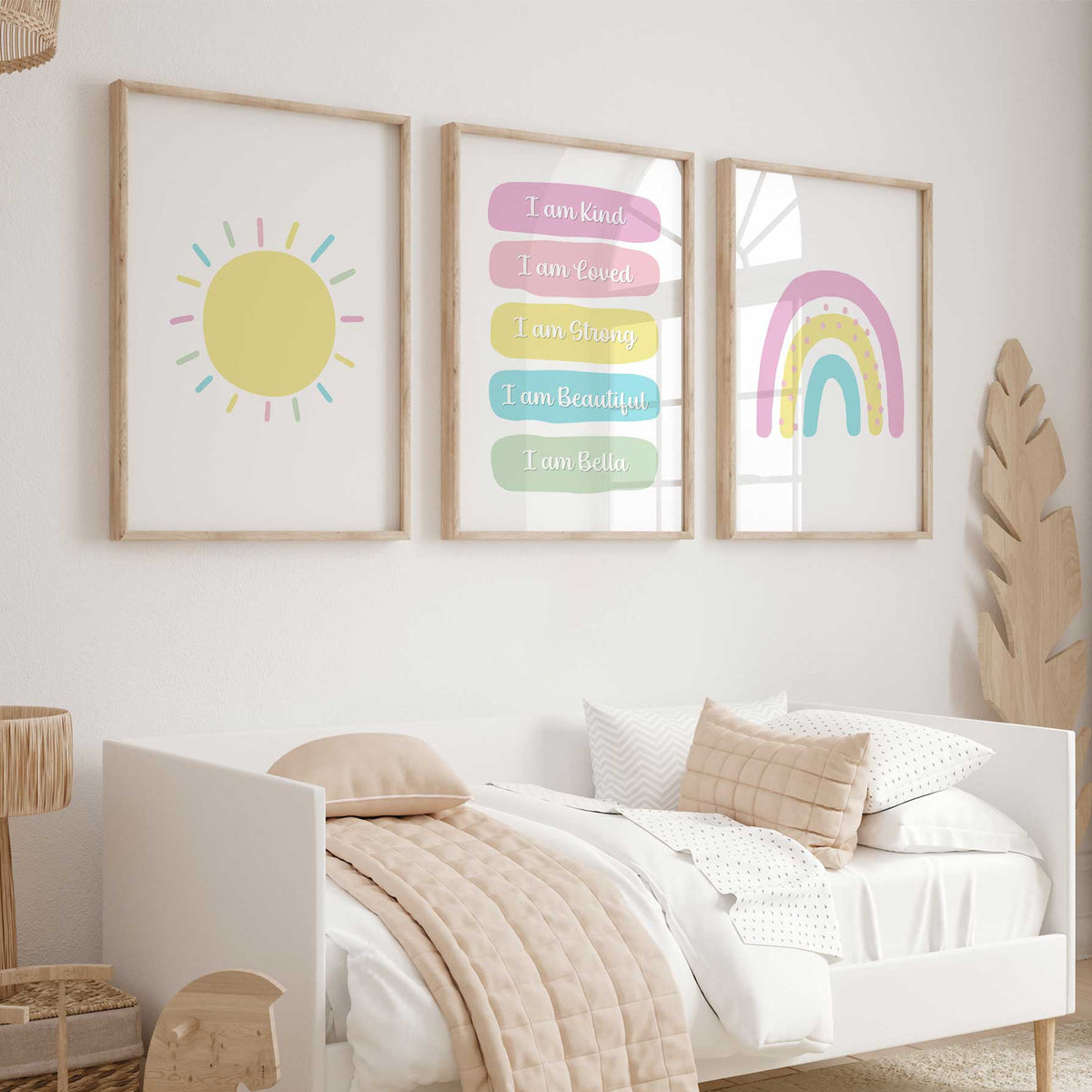 Three pastel prints with a yellow sun, personalised affirmations and a pink aqua rainbow.