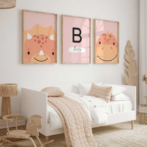 Set of three personalised pink dinosaur prints with two dinosaurs and a custom initial and child’s name