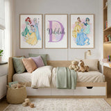 Personalised girls wall art set with princess themed character prints and a custom initial name design in soft pastel colours