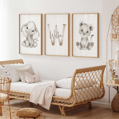 Personalised safari nursery wall art set with baby elephant, lion cub and custom initial name print in soft neutral tones