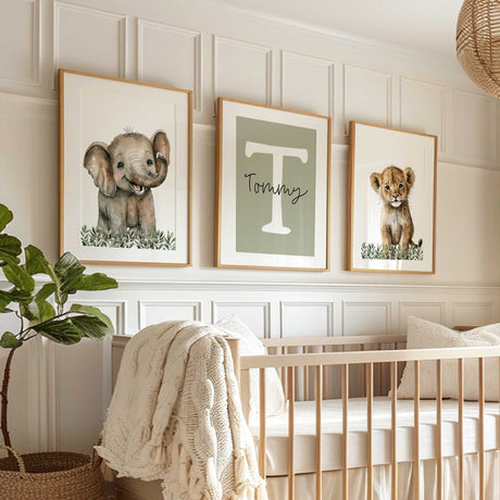 Safari print set with baby elephant, lion cub and a white initial with the name on a sage green background.
