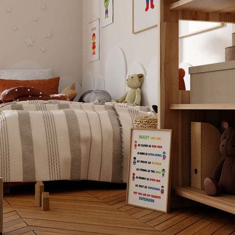 Personalised superhero wall art for boys bedroom featuring colourful superhero characters and a custom child’s name.