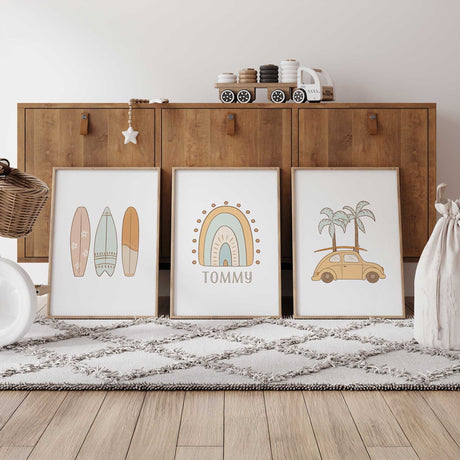 Set of three personalised surf prints with pastel surfboards, a rainbow with name underneath and a yellow beach car with palm trees.