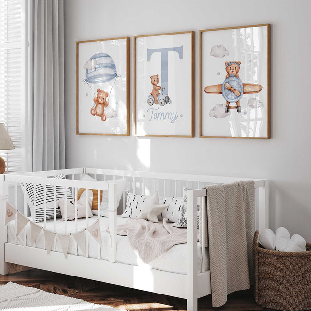 Personalised teddy bear print set with a blue initial and name, a bear under a parachute and a bear in a plane.
