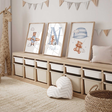 Personalised teddy bear nursery set with a blue initial, name, bear in a plane and blue striped parachute
