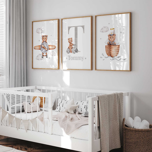 Three teddy bear prints with a pilot, sailing bear and grey initial with name, illustrated in brown and grey.