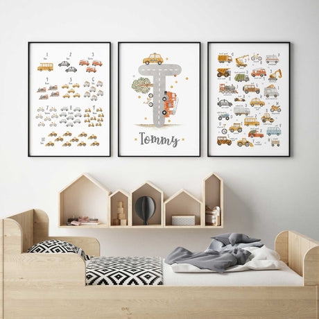 Transport alphabet and counting prints with watercolour vehicles beside a grey road T initial and Tommy name.