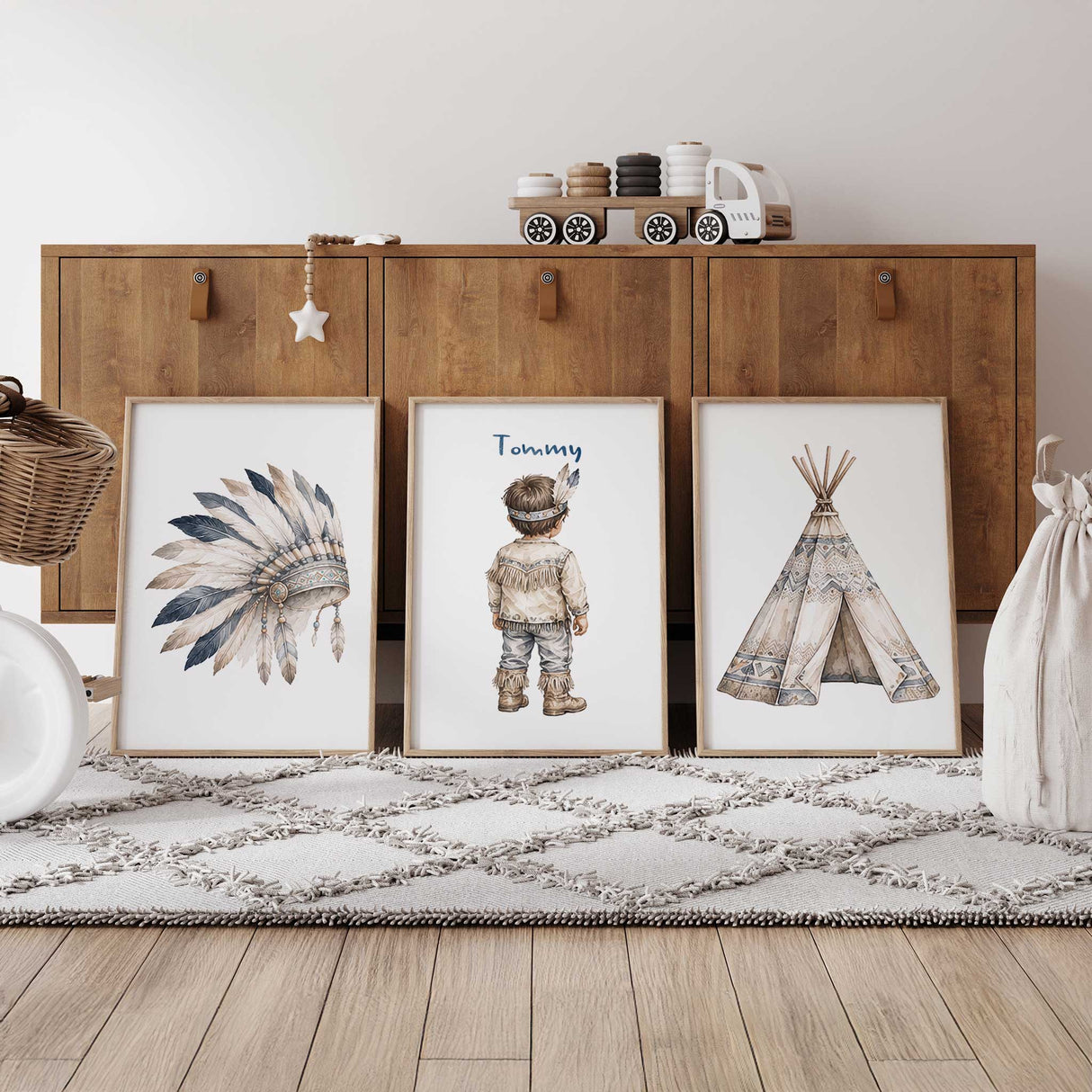 Personalised tribal nursery print set of three featuring a feather headdress, named little boy and patterned teepee.