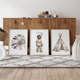 Personalised tribal nursery print set of three featuring a feather headdress, named little boy and patterned teepee.