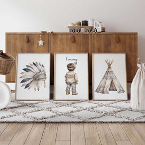 Personalised tribal nursery print set of three featuring a feather headdress, named little boy and patterned teepee.
