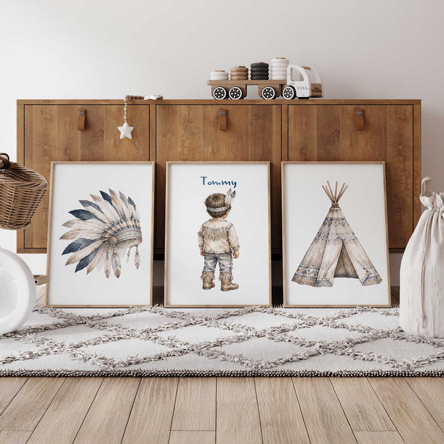 Personalised tribal nursery print set of three featuring a feather headdress, named little boy and patterned teepee.