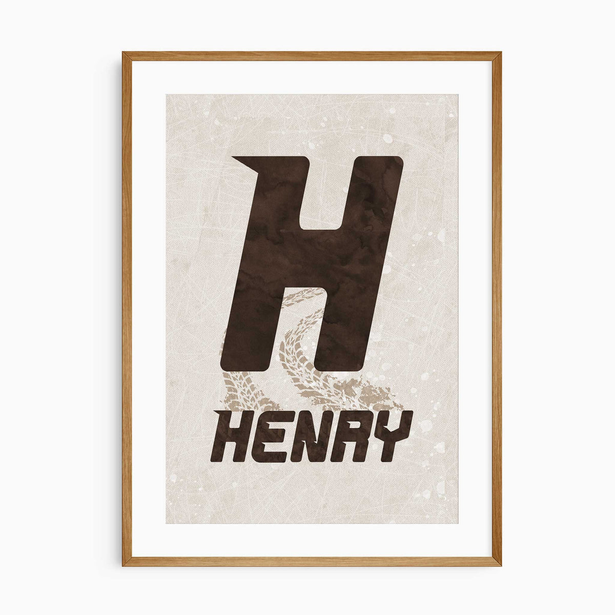 Personalised name print with a dark brown racing-style initial, uppercase name and beige tyre tracks on a beige background.