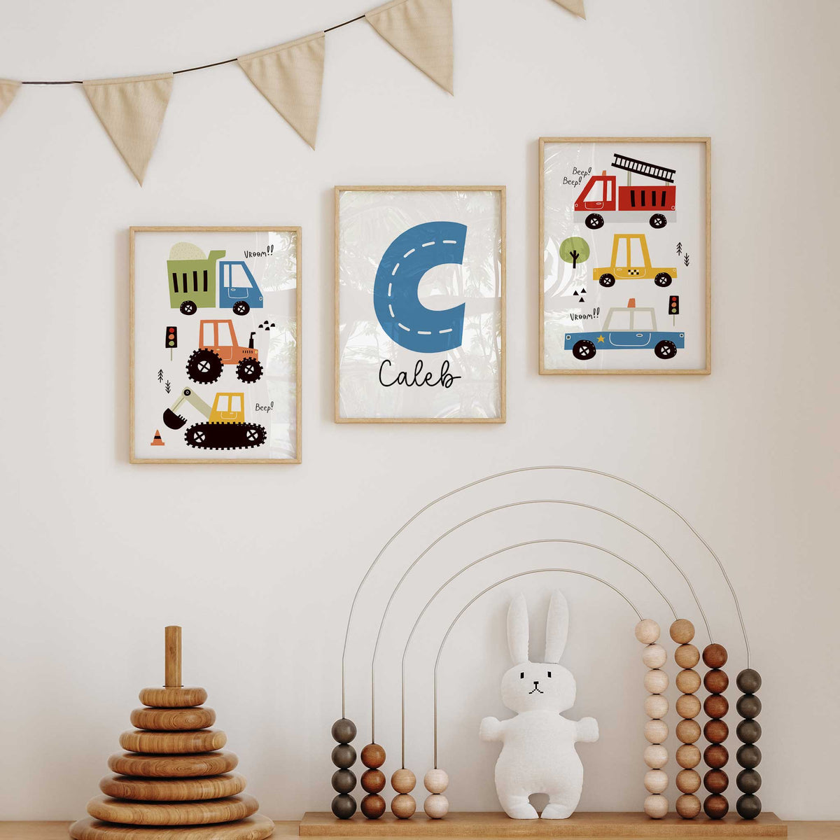 Three personalised vehicle prints with colourful cars, construction vehicles and a road-style initial