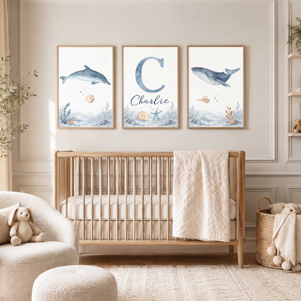 Personalised ocean print set of three with a blue whale, dolphin, sandy fish and a initial and the childs name.