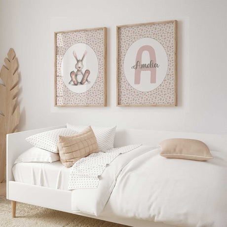 Floral bunny and Amelia name prints with a pink initial, green script and matching rose patterns around white ovals.