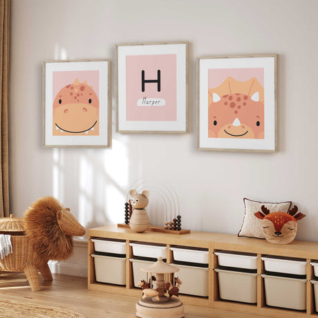 Pink illustrated dinosaur wall print in soft blush and coral colours for a young girl’s bedroom or playroom