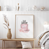 Floral fashion wall art featuring a soft pink perfume bottle and delicate flowers in a watercolour-inspired design.