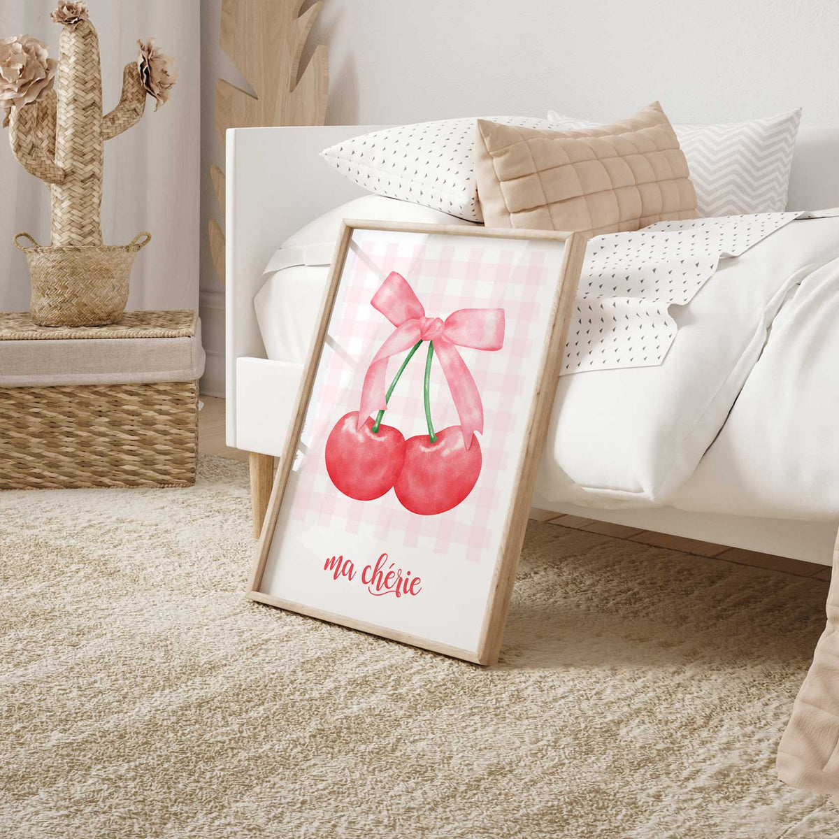 Pink gingham cherry print with two bright red cherries, a pale pink ribbon bow and decorative French lettering.