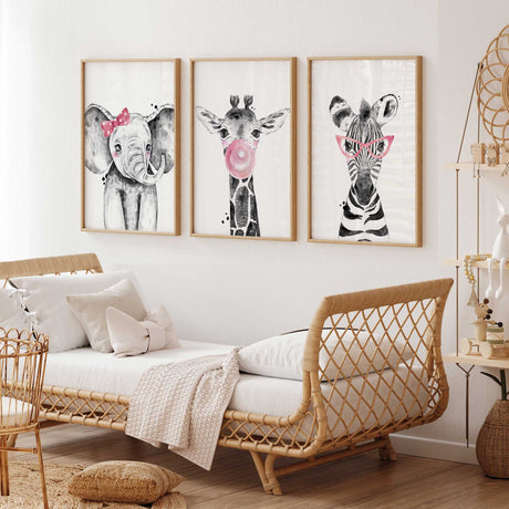 Pink safari animal wall art set designed for baby girl nursery featuring zebra giraffe and elephant illustrations