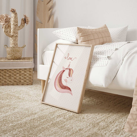 Soft pink unicorn wall art with blush and neutral tones and delicate love script above the illustrated unicorn