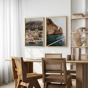 Set of two Positano wall art prints featuring colourful Italian coastal buildings, boats, rocky cliffs and blue water