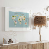 Prehistoric world map poster with dinosaurs and continent names for a child’s bedroom or playroom.