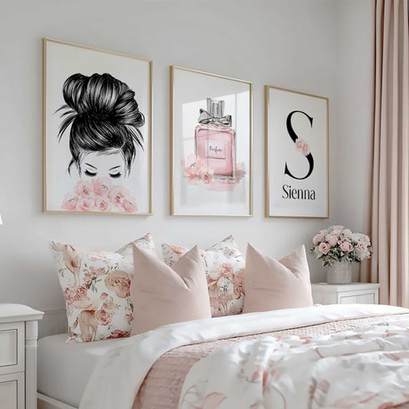 A framed print of a large black letter with the name written below it and a small cluster of pink flowers on the letter personalized for girls room r teenager