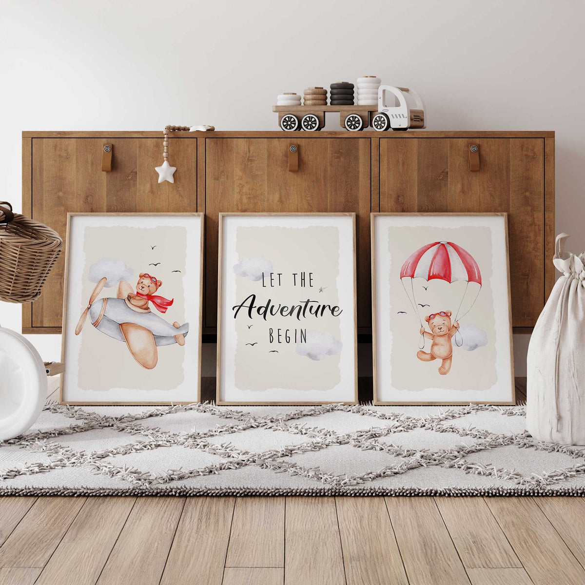 Red teddy bear adventure print set with a parachuting bear, a pilot bear and Let the Adventure Begin lettering on beige.