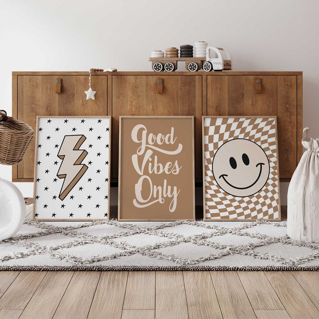 Set of three retro kids wall art prints featuring a smiley face, Good Vibes quote and neutral lightning bolt design