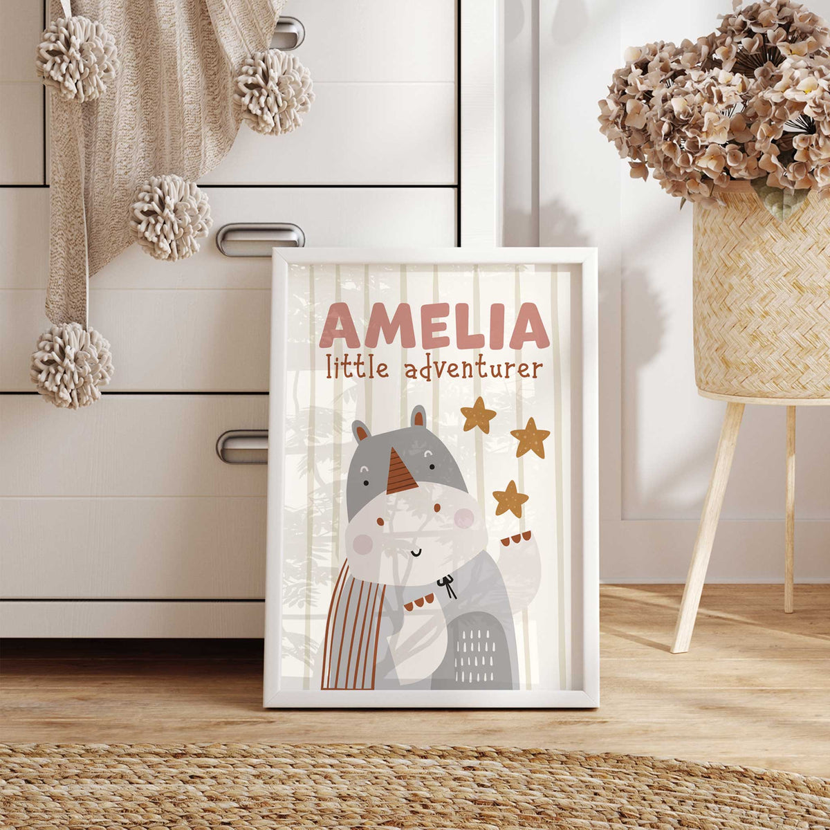 Personalised rhino wall print with child’s name, little adventurer wording and a soft striped safari background.