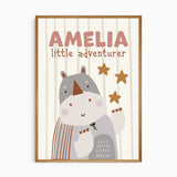 Personalised rhino safari print with dusty rose name lettering, star accents and a softly striped nursery background.